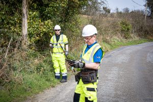 Indigo fibre surveyors on a road