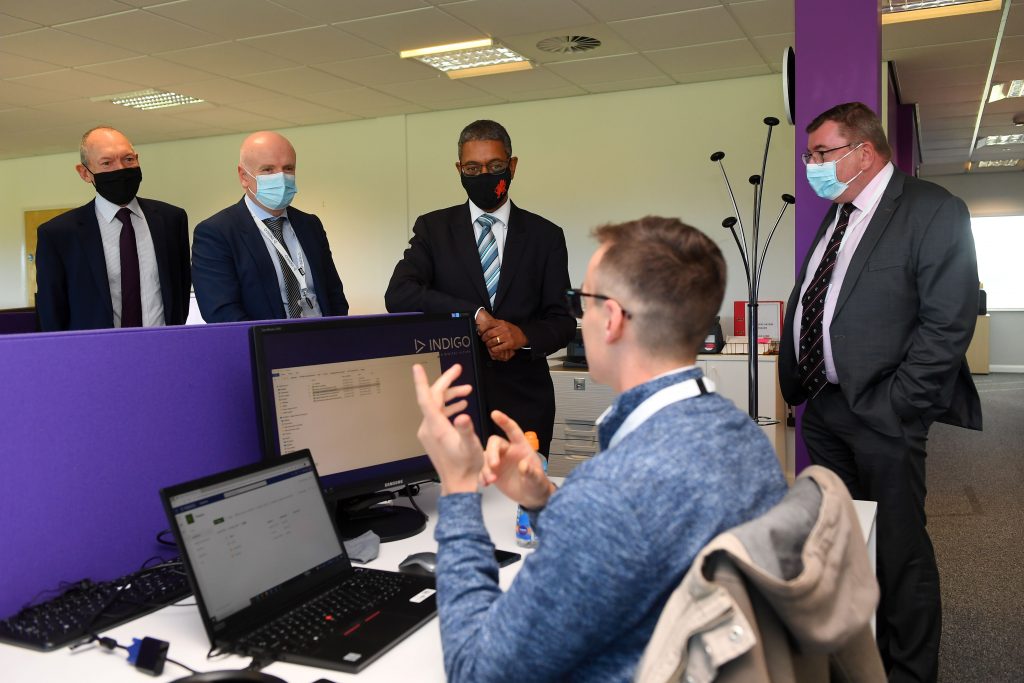 Minister Vaughan Gething and John Griffiths talk to Indigo staff